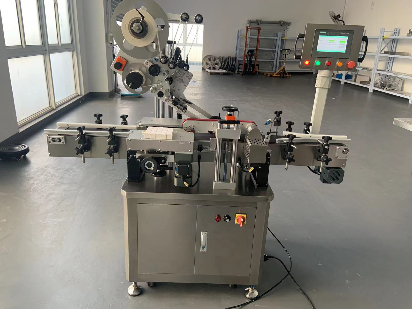 Customized box labeling machine in operation